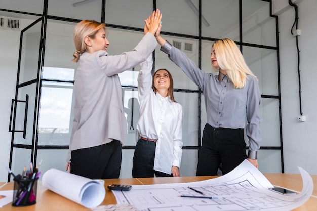 Corporate female employees celebrating