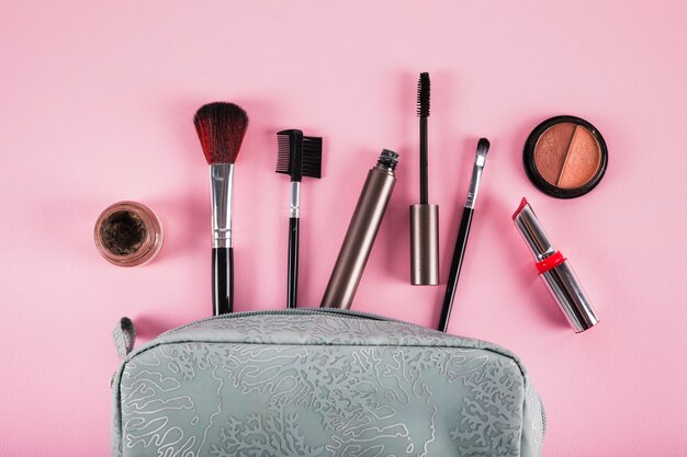 Cosmetic bag containing lipstick; mascara; eyeliner and brushes