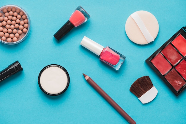 Cosmetic beauty products on blue background