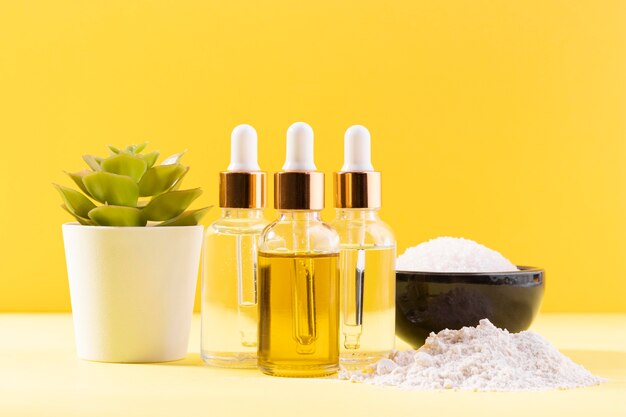 Cosmetic bottles and bowl with salts