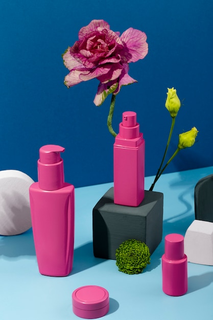 Cosmetics containers and flowers arrangement
