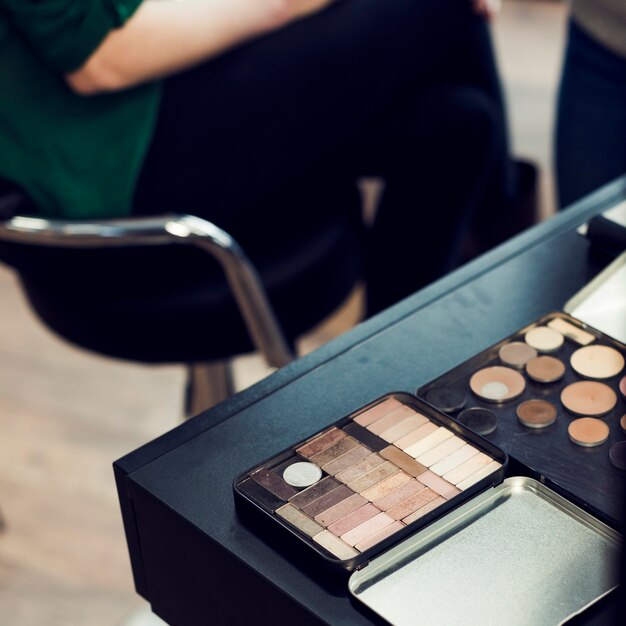 Cosmetics palettes on table