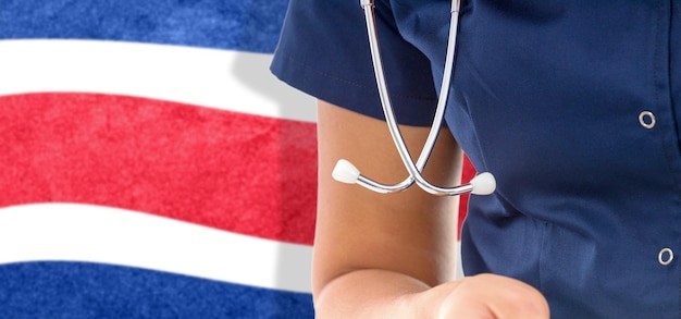 Costa Rica flag female doctor with stethoscope, national healthcare system