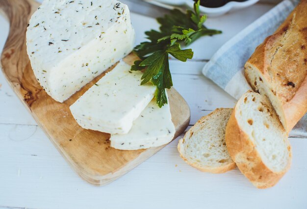 Cottage cheese with baguette and olives