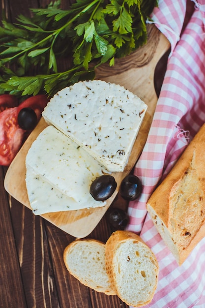 Cottage cheese with baguette and olives