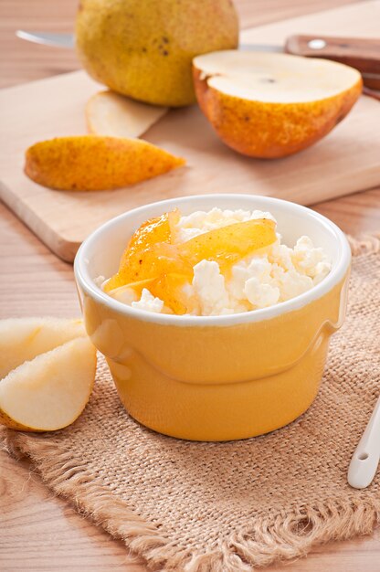 Cottage cheese with pear jam in a bowl