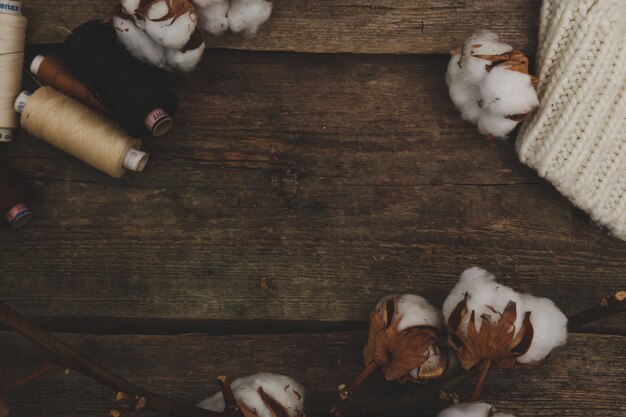 Cotton flowers on wooden table