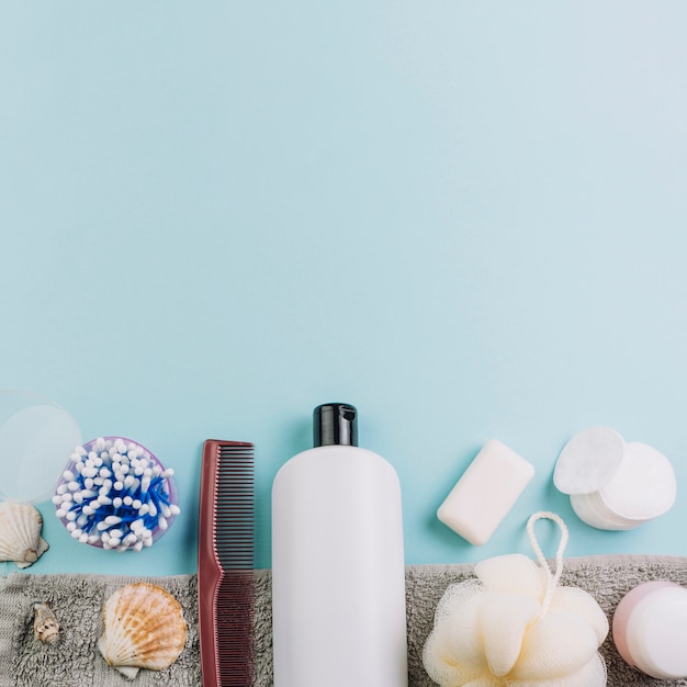 Cotton pads and swabs near cosmetics bottle