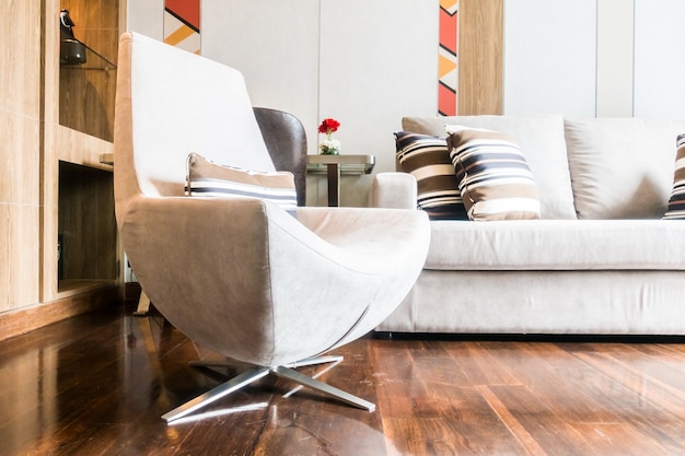 Couch and armchair seen from the floor