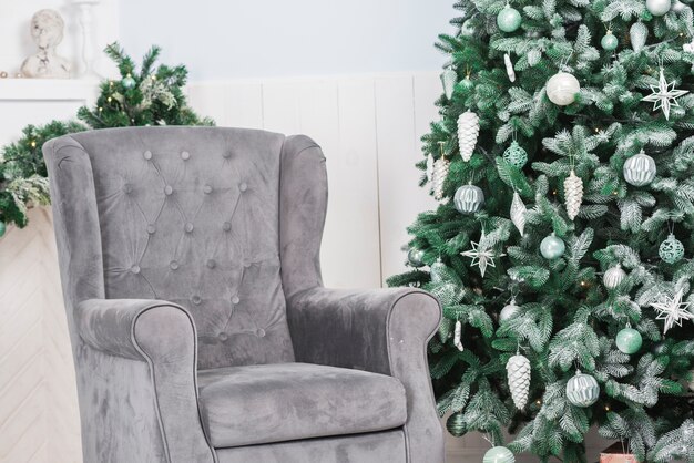 Couch next to christmas tree