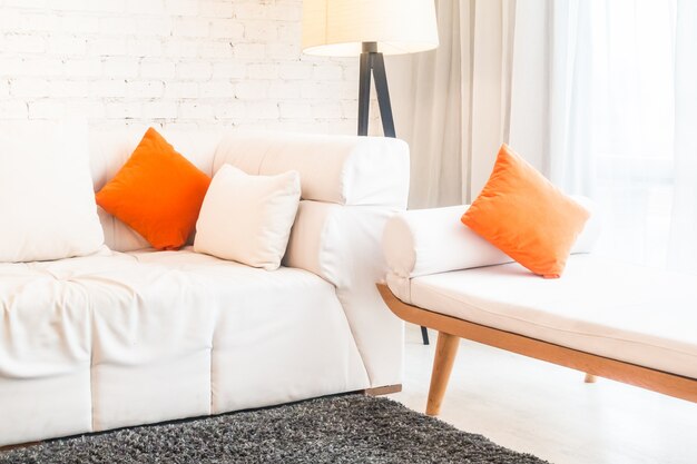 Couch with orange cushions