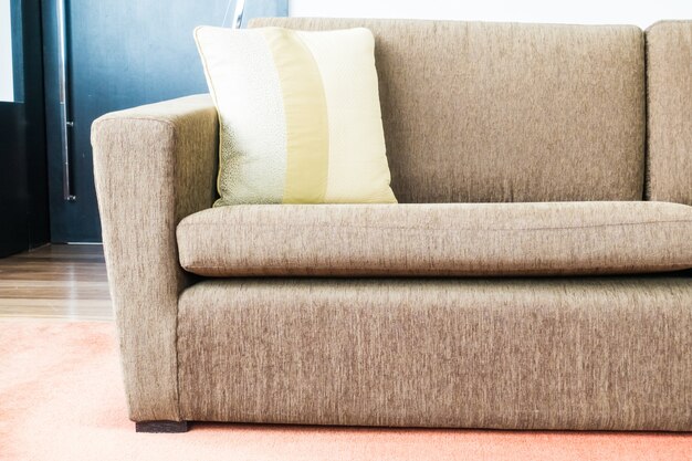 Couch with a yellow cushion