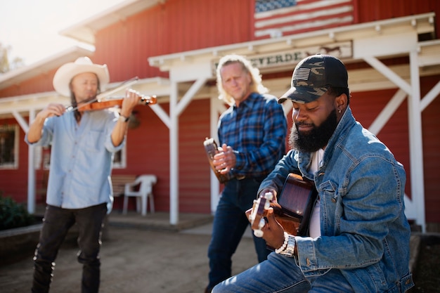 Free photo country music band singing outdoors