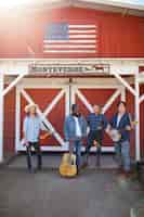 Free photo country music band singing outdoors