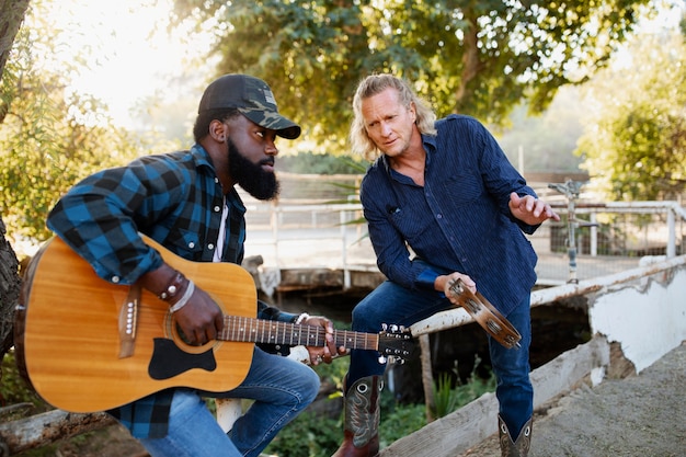 Free photo country music band singing outdoors