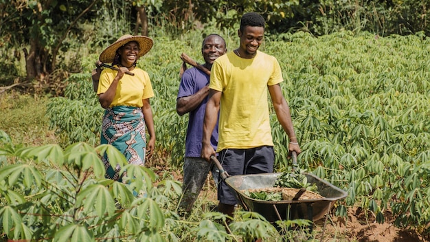 Countryside people pushing a wheelbarrow