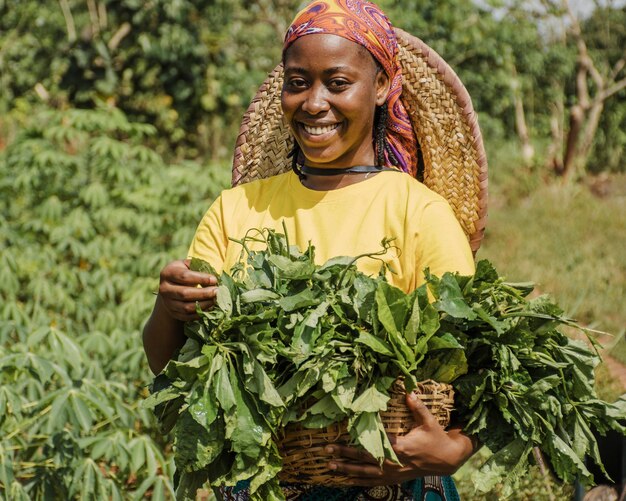 Countryside woman holding plant leaves