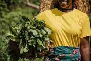 Free photo countryside woman holding plant leaves