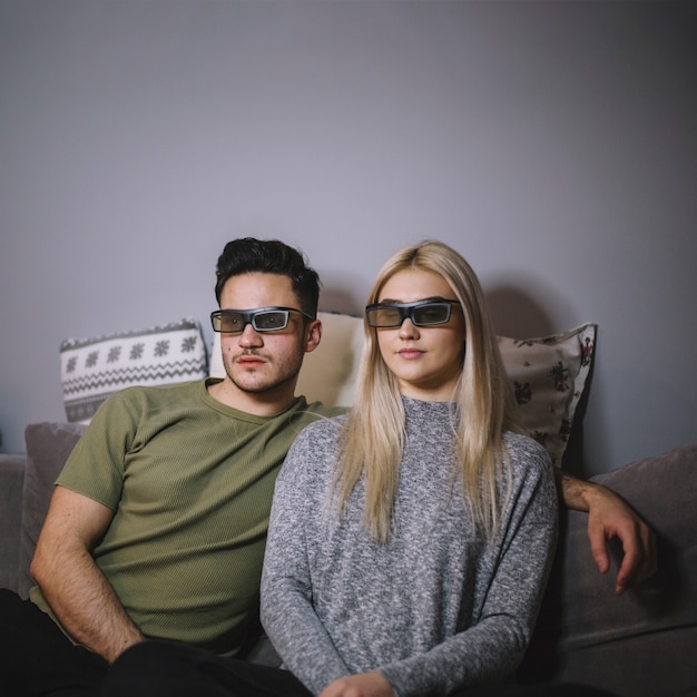 Couple in 3D glasses watching film