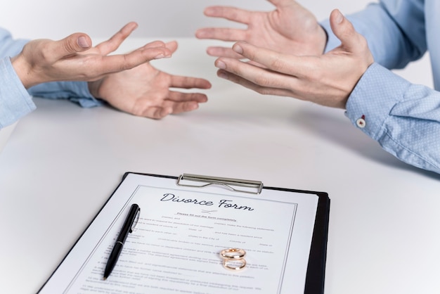 Couple arguing before signing divorce form