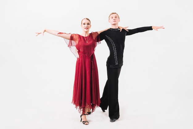 Free photo couple in ballroom costumes posing for camera