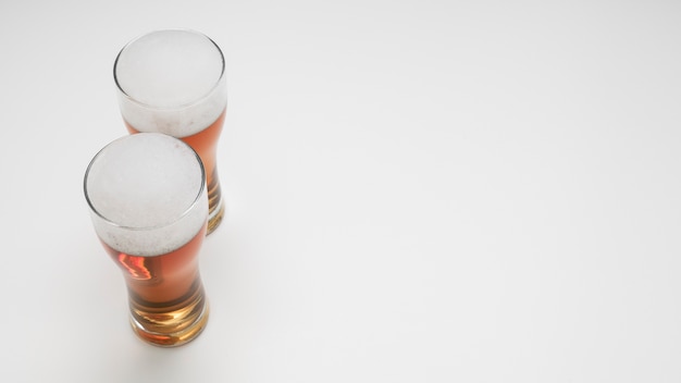 Free photo couple of beer glasses with copy space