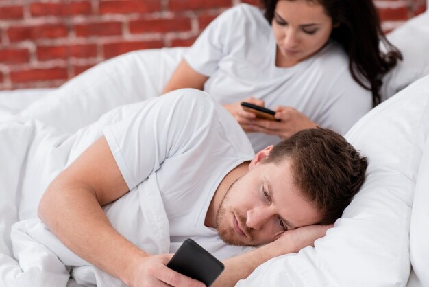 Couple being addicted to social media