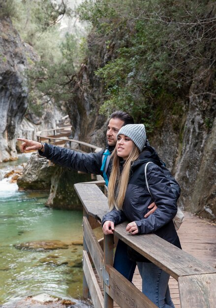 Couple on bridge exploring nature