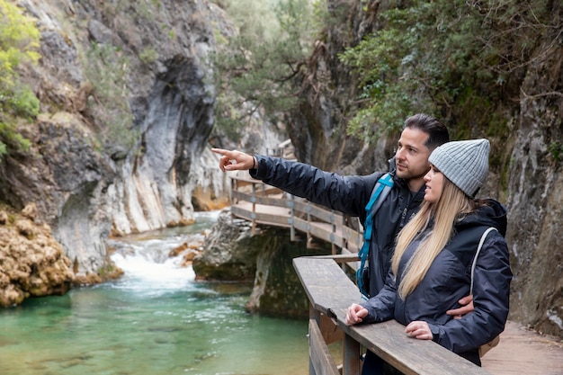 Couple on bridge exploring nature