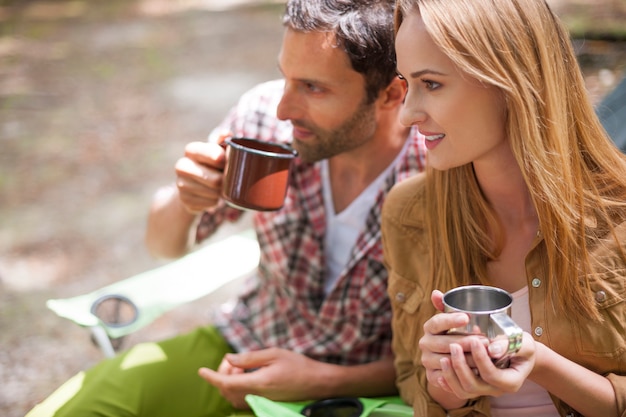 Free photo couple camping in the forest