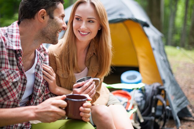 Couple camping in the forest