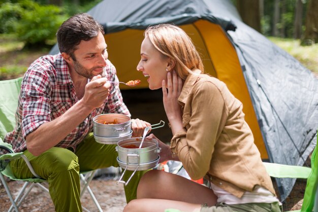 Couple camping in the forest