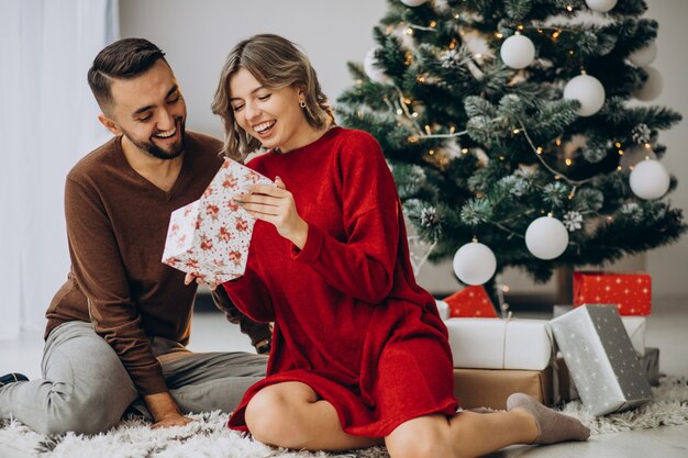 Couple celebrating Christmas together at home