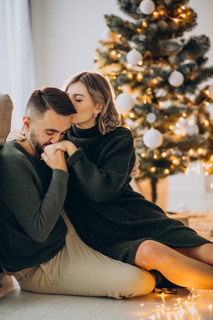 Couple celebrating christmas together at home