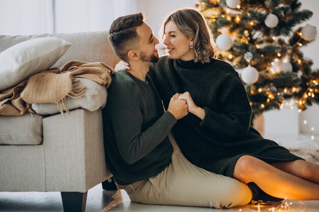 Couple celebrating christmas together at home