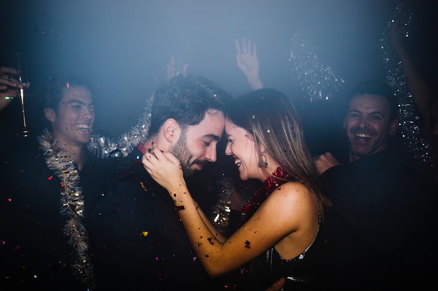 Couple celebrating and dancing in club