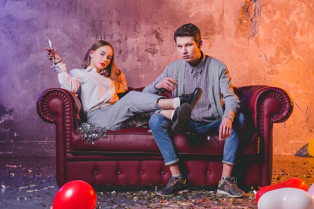 Couple celebrating and looking at camera