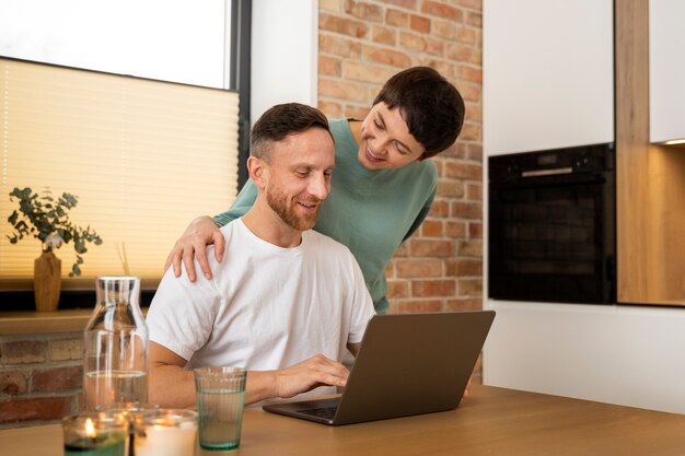 Couple celebrating pregnancy announcement at home