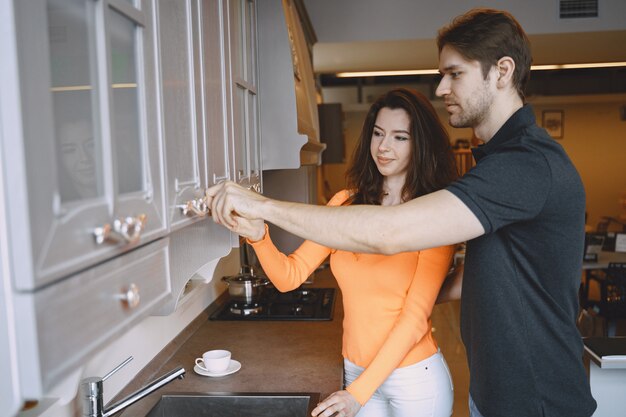 Couple choosing furniture in furniture store