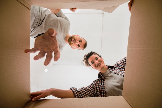 Couple choosing things from box