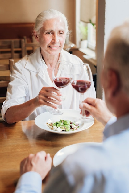 Couple clinking glasses in a toast