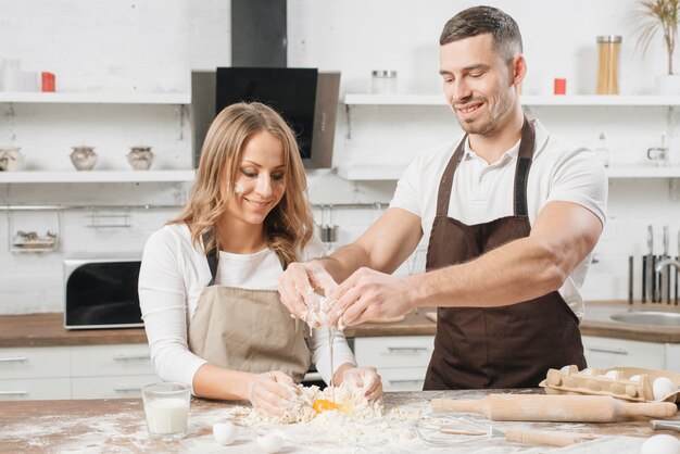 Couple cooking cake