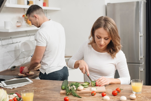 Free photo couple cooking at home