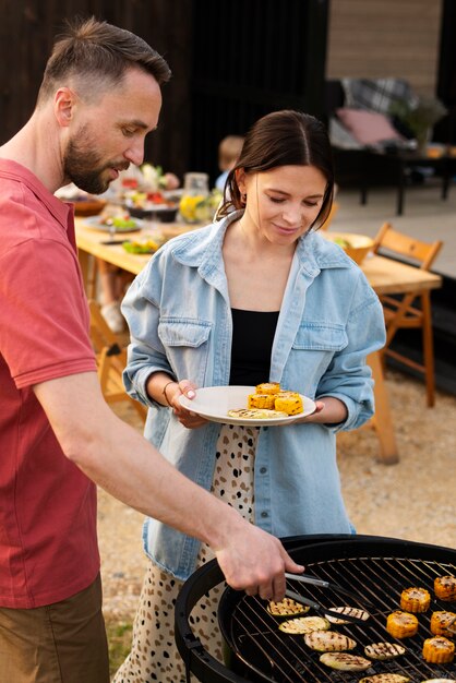 Couple cooking together medium shot