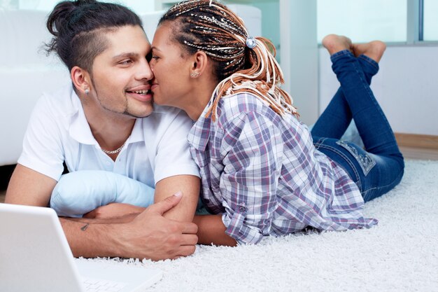 Couple cuddling on the floor