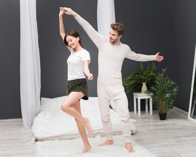 Couple dancing at home