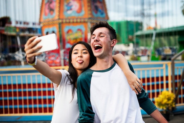 Free photo couple dating relaxation love theme park concept