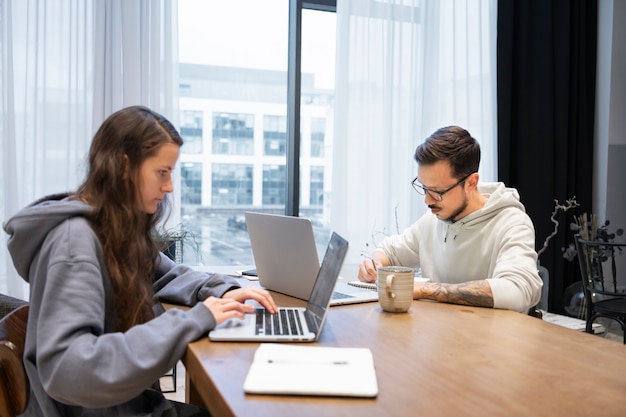 Couple at desk working together from home