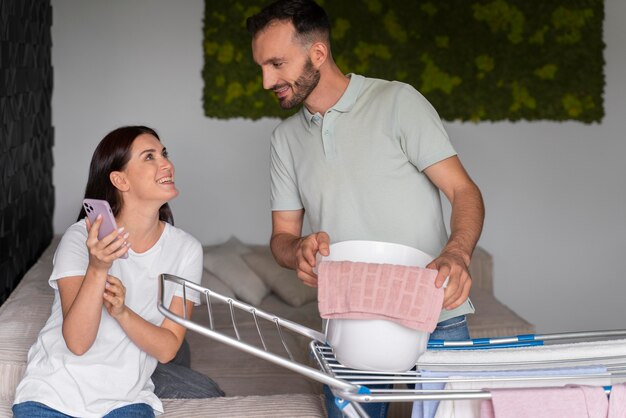 couple doing the laundry together at home