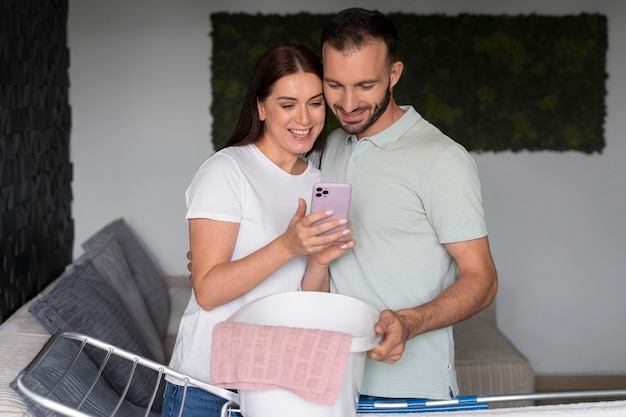 Couple doing the laundry together at home